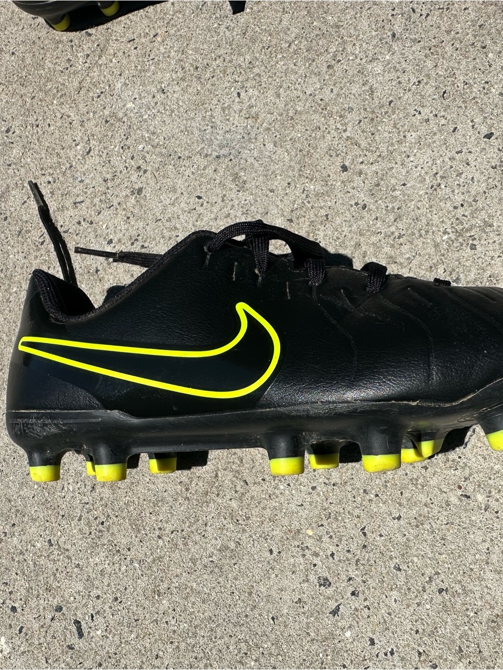 Nike Black Soccer Cleats with Neon Yellow Accents